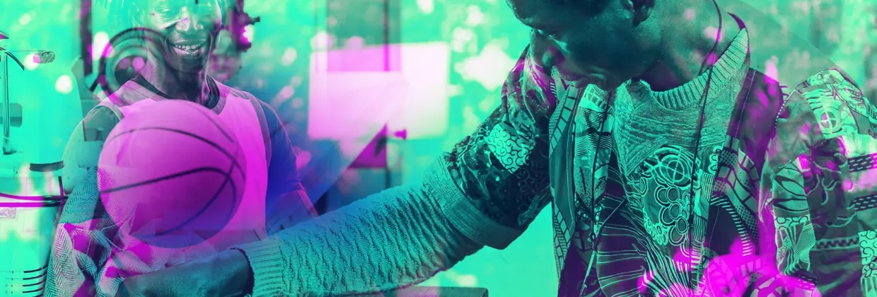 Two people smiling while holding a basketball next to a robotic device, shown with a coloured overlay.